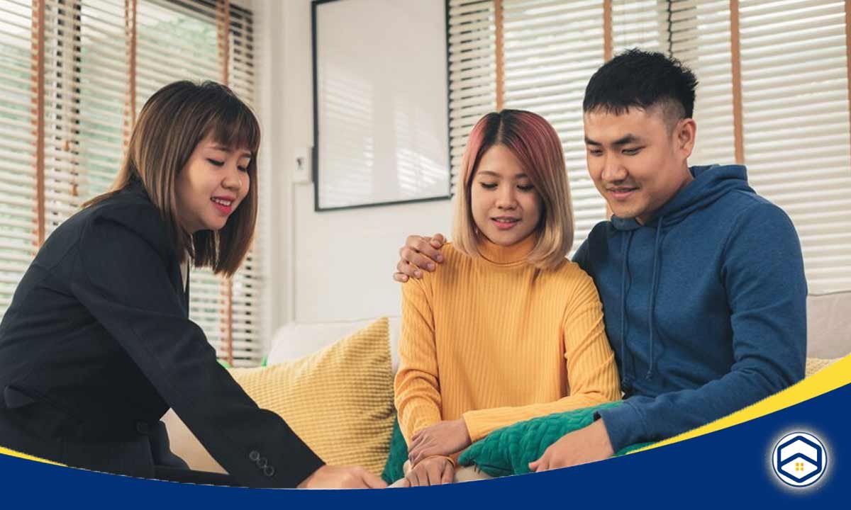 The image shows a group of three young adults discussing and considering the various factors and options for a flexible lease agreement.