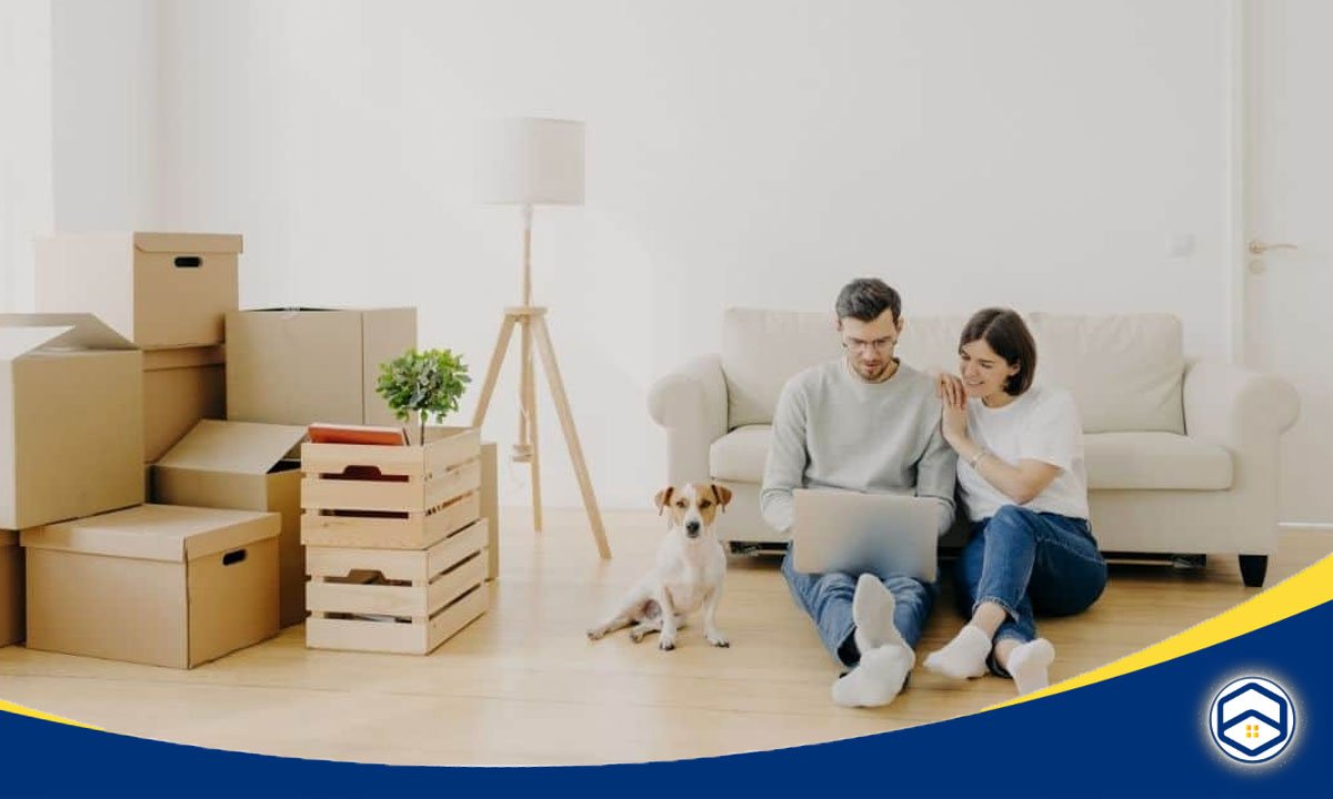 This image showcases a couple and their dog in a cozy, furnished apartment, highlighting the types of long-term rental options available in Houston for those seeking a comfortable living space.