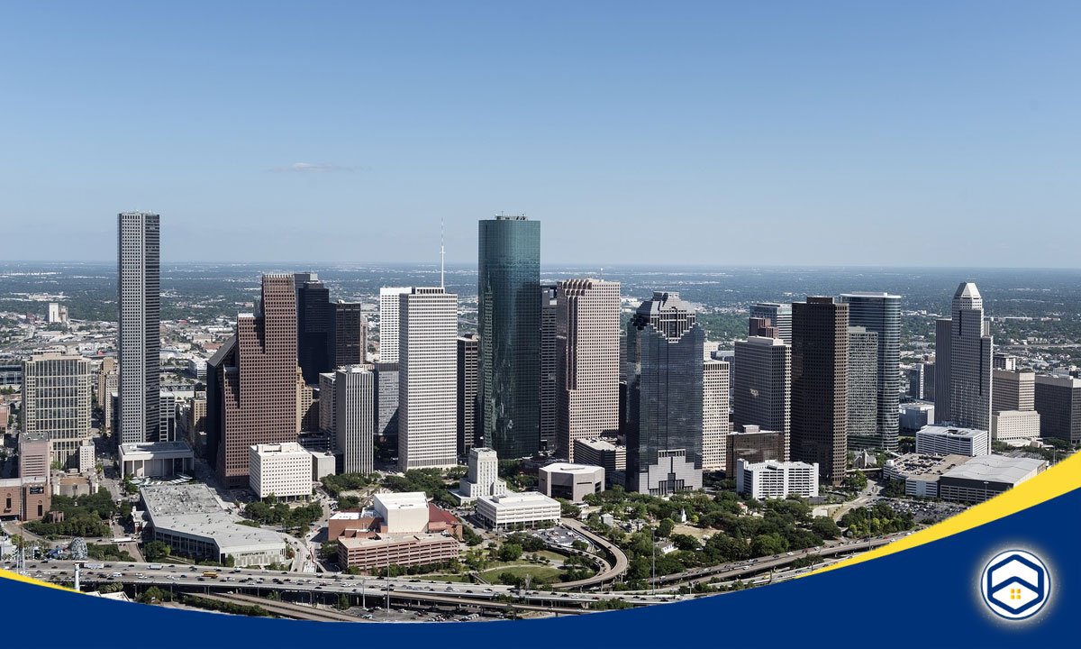 An aerial view of the Houston skyline, showcasing the city's impressive high-rise buildings and infrastructure, highlighting why Houston is an attractive destination for long-term rentals 