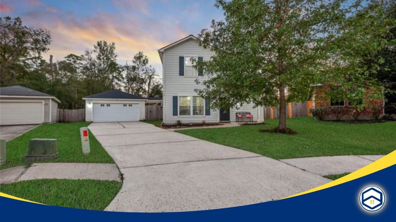 Single-family home with a driveway, green lawn, and trees in a peaceful suburban neighborhood.