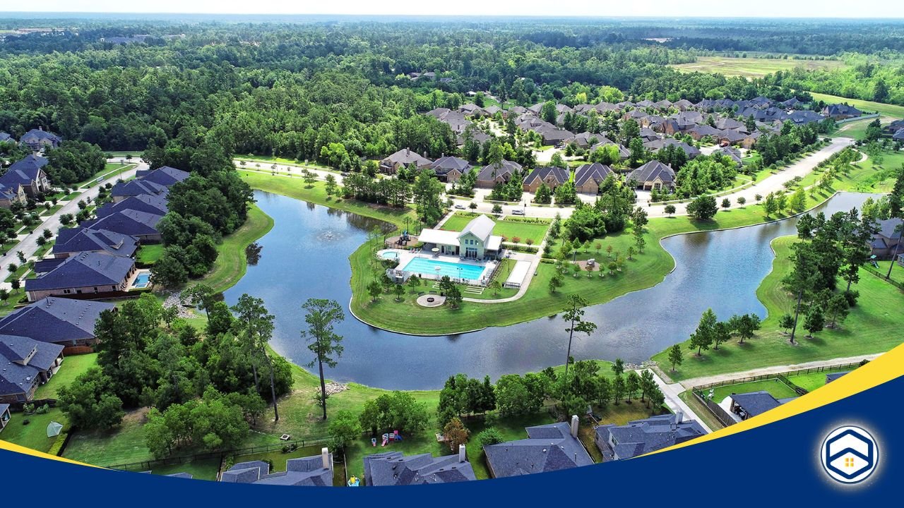 Aerial view of Harpers Preserve showing a lake, swimming pool, green spaces, and rows of houses in a planned neighborhood.