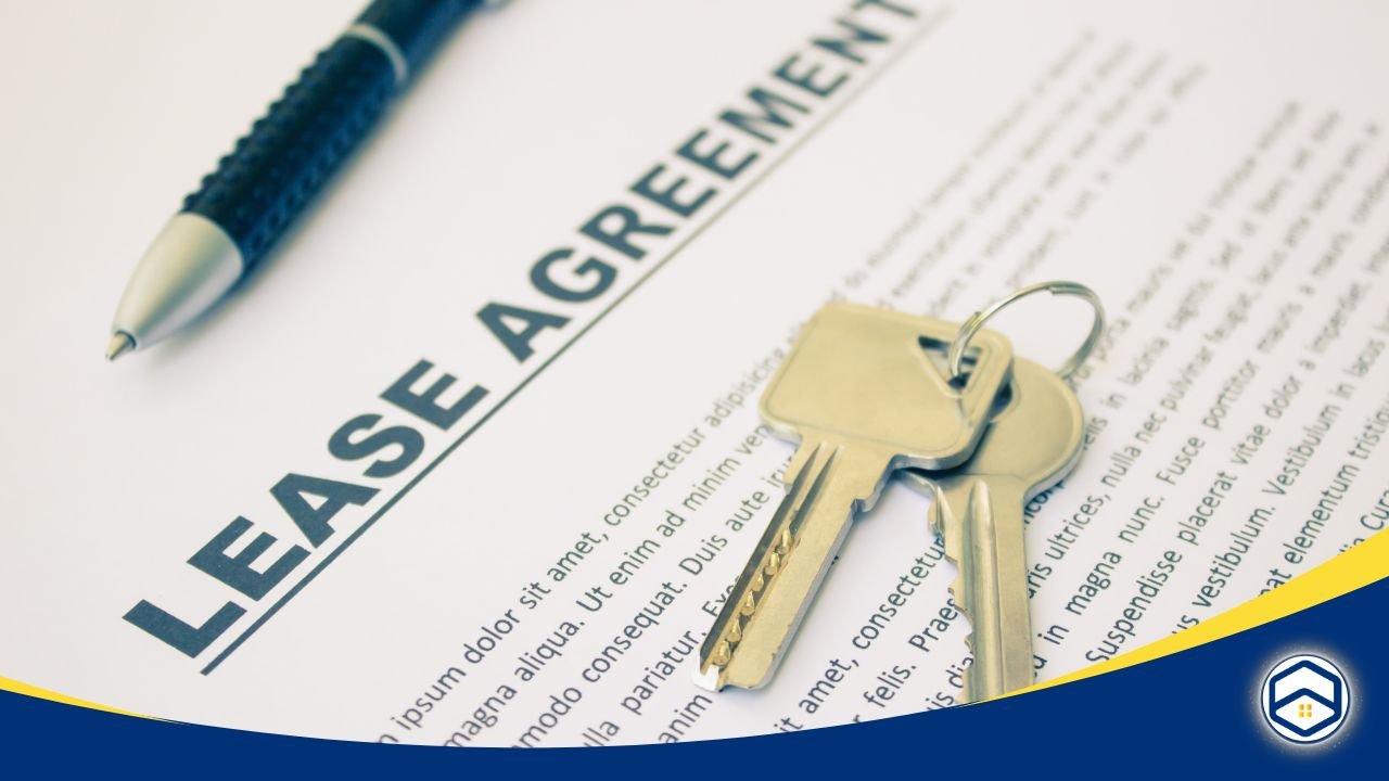 Close-up of a lease agreement document with a pen and house keys on top.