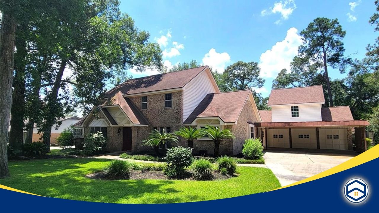 A beautiful two-story brick home surrounded by lush greenery and tall oak trees in the River Plantation neighborhood.