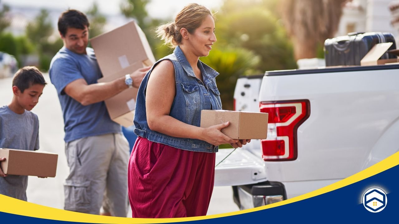 Family unloading boxes from a truck during a move.