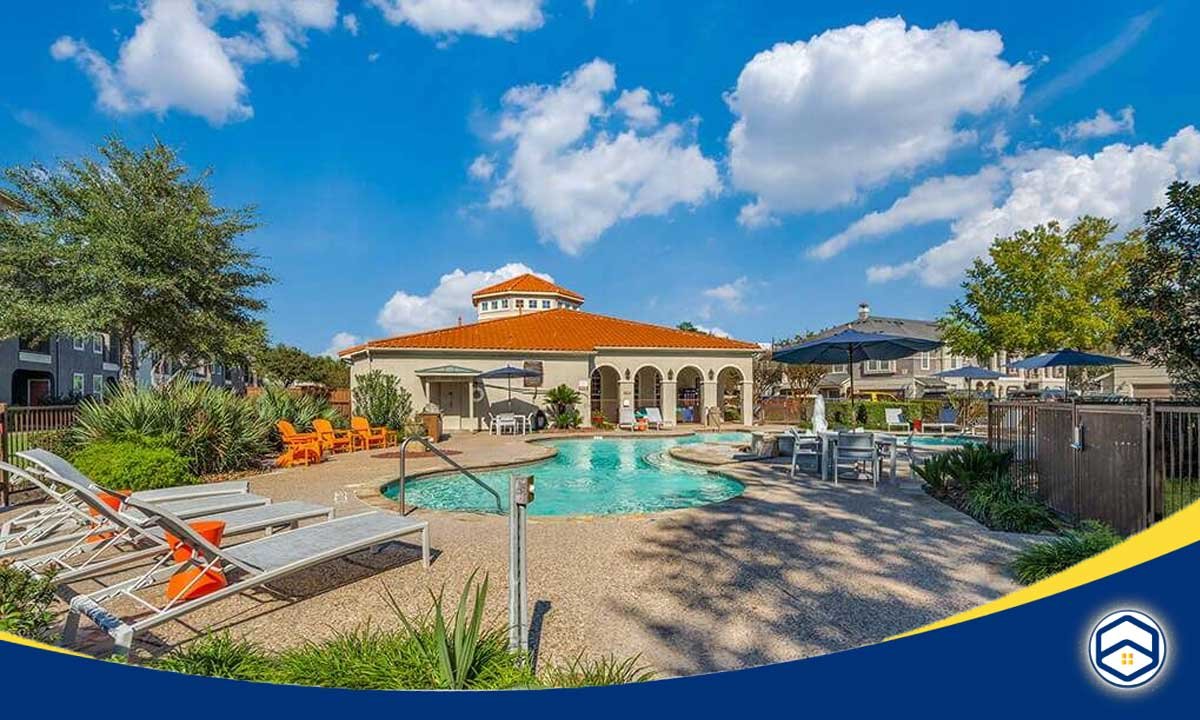 The image shows an outdoor swimming pool and amenities of a luxury apartment complex, which appears to be one of the "Top Conroe Apartments Offering Video Walkthroughs" mentioned in the blog topic.