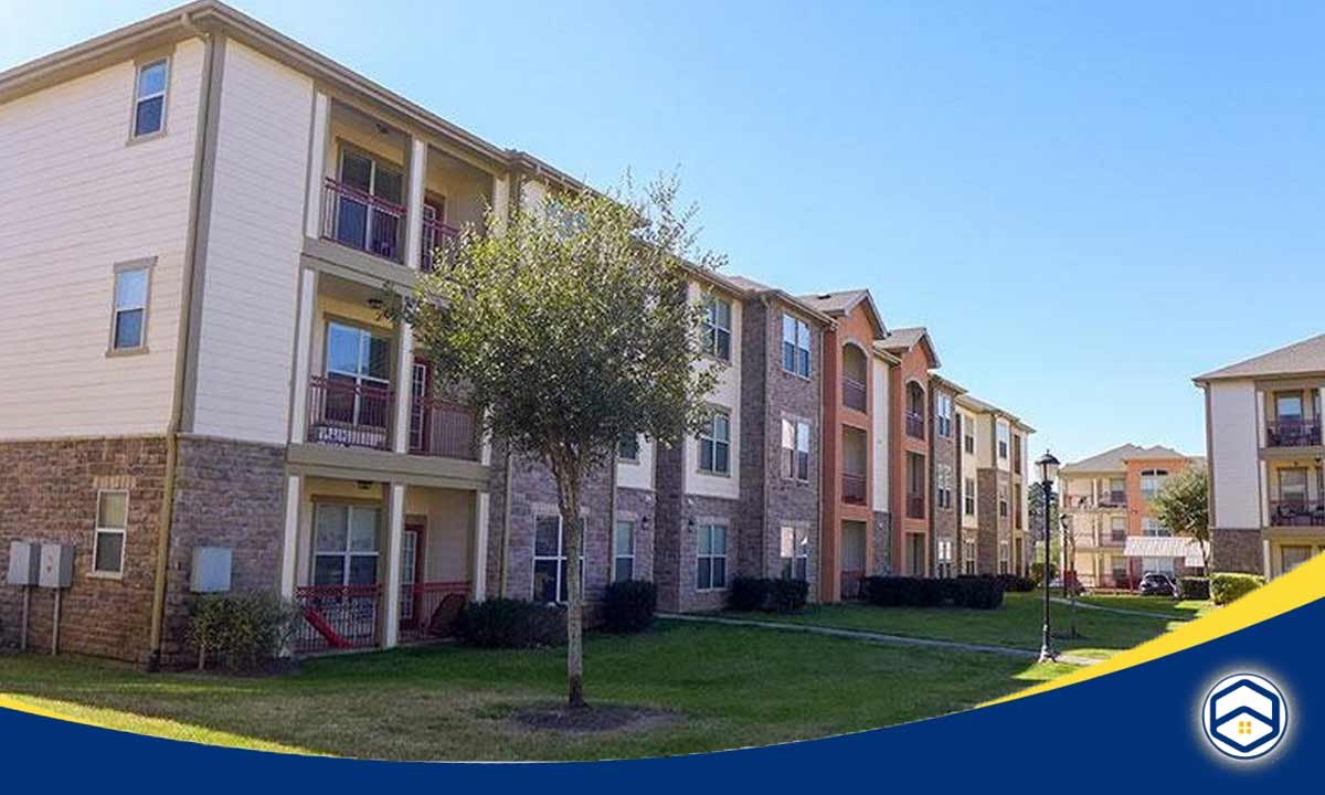 he image shows a modern apartment complex with multiple buildings, which is relevant to the topic of affordable monthly rent in Santa Fe and the benefits of budget apartments.