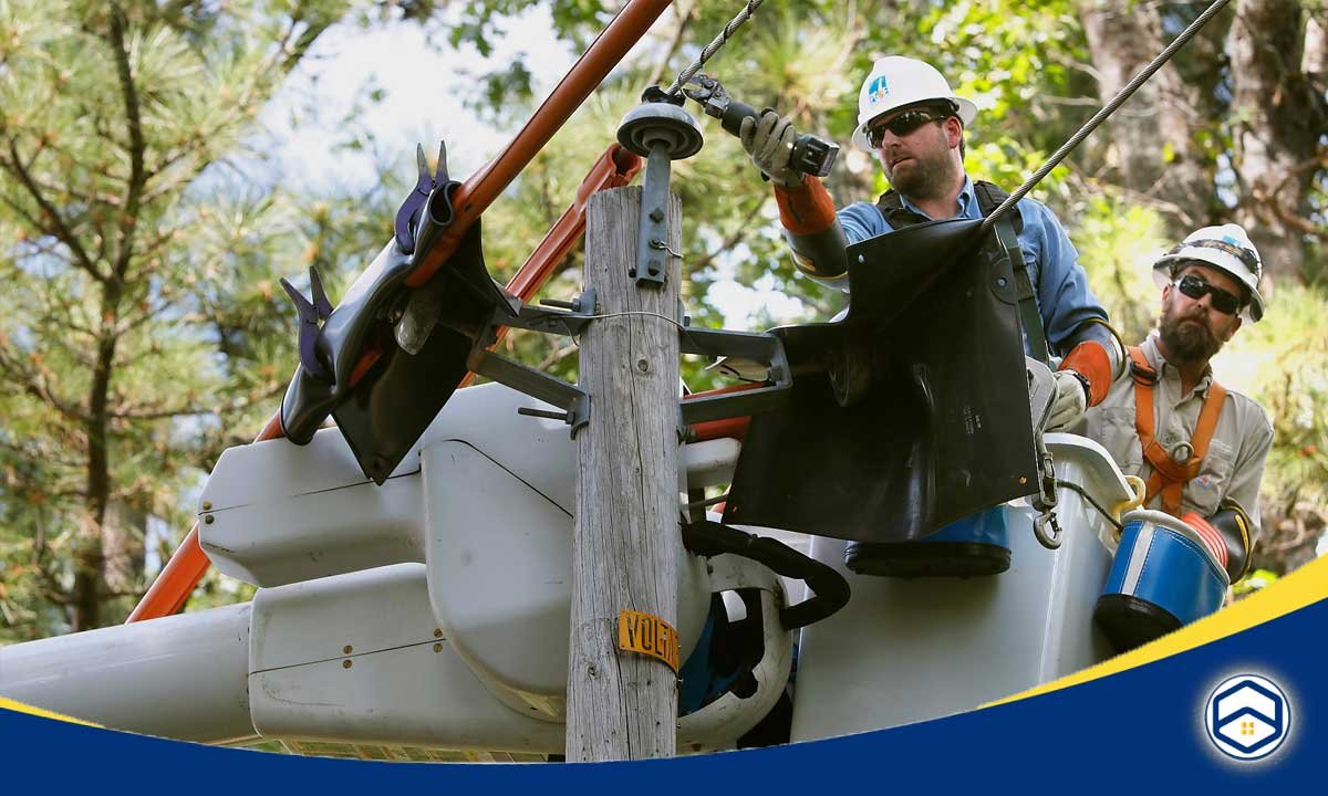 The image shows CenterPoint Energy workers performing maintenance or repair work on electrical infrastructure, highlighting their role in electricity delivery service in the Houston area as part of the Houston Utility Setup Guide.