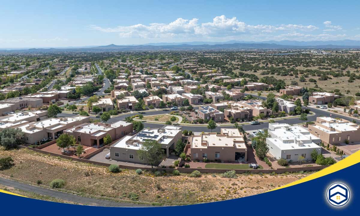 The image shows an aerial view of the Rancho Viejo community, a top-rated neighborhood within the Santa Fe, New Mexico area.