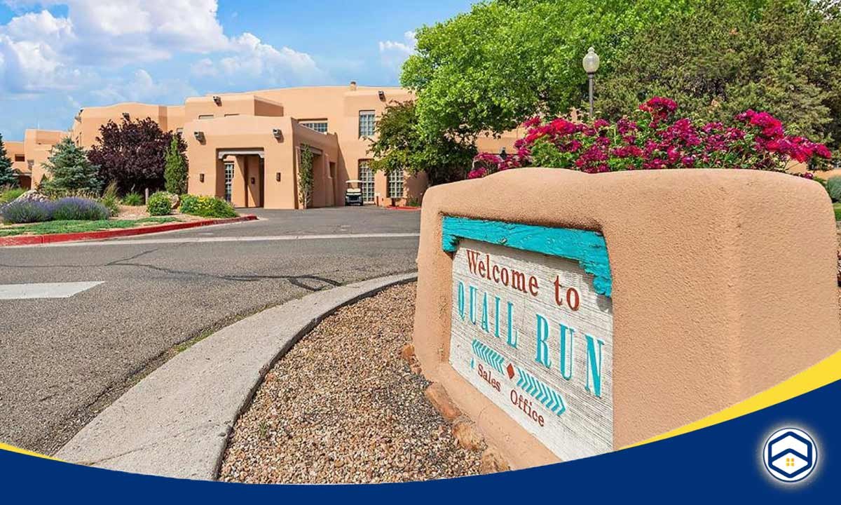 The image shows the entrance sign and landscaping for the Quail Run community, which appears to be another top-rated residential development within the Santa Fe.