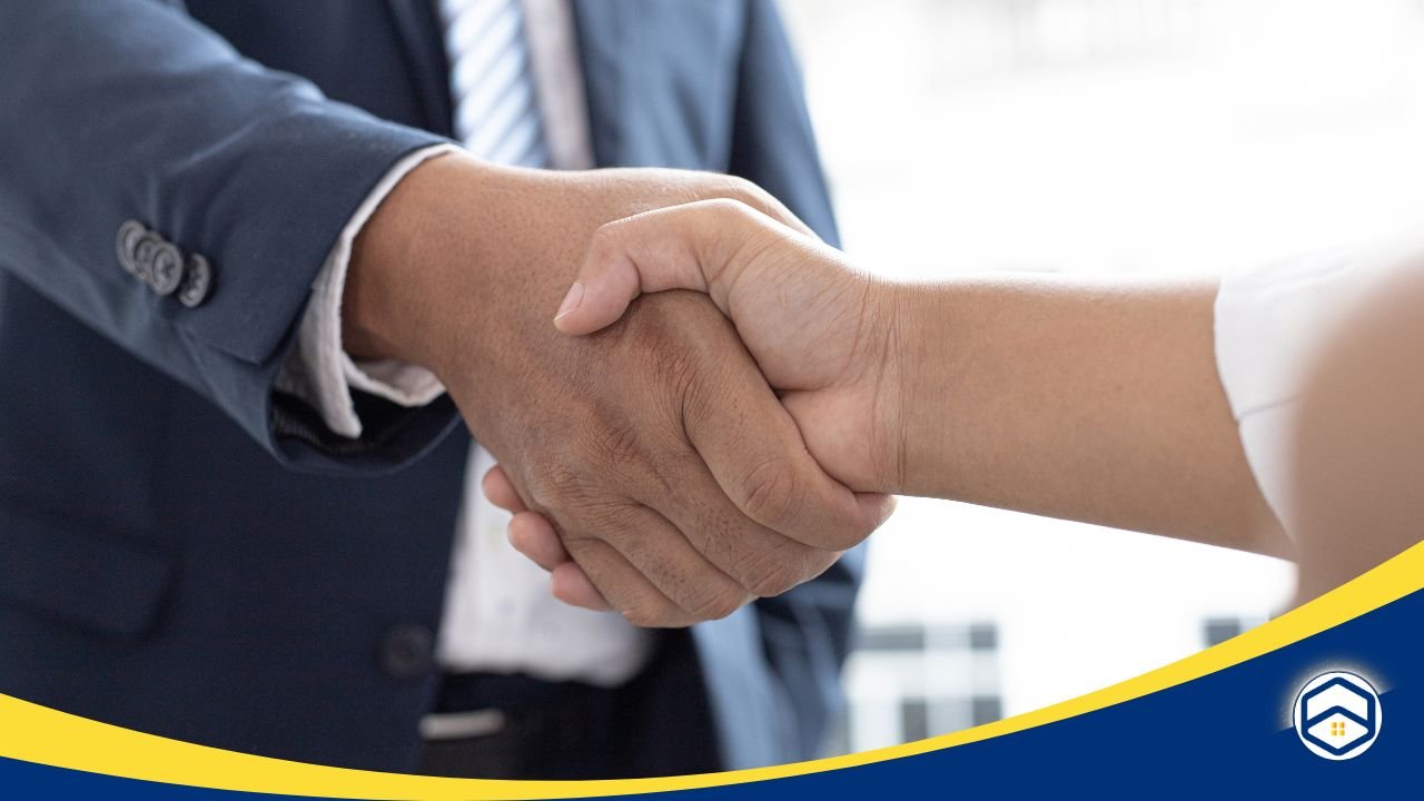 Close-up of a handshake representing an agreement, emphasizing the need to document verbal agreements in writing for clarity and protection.