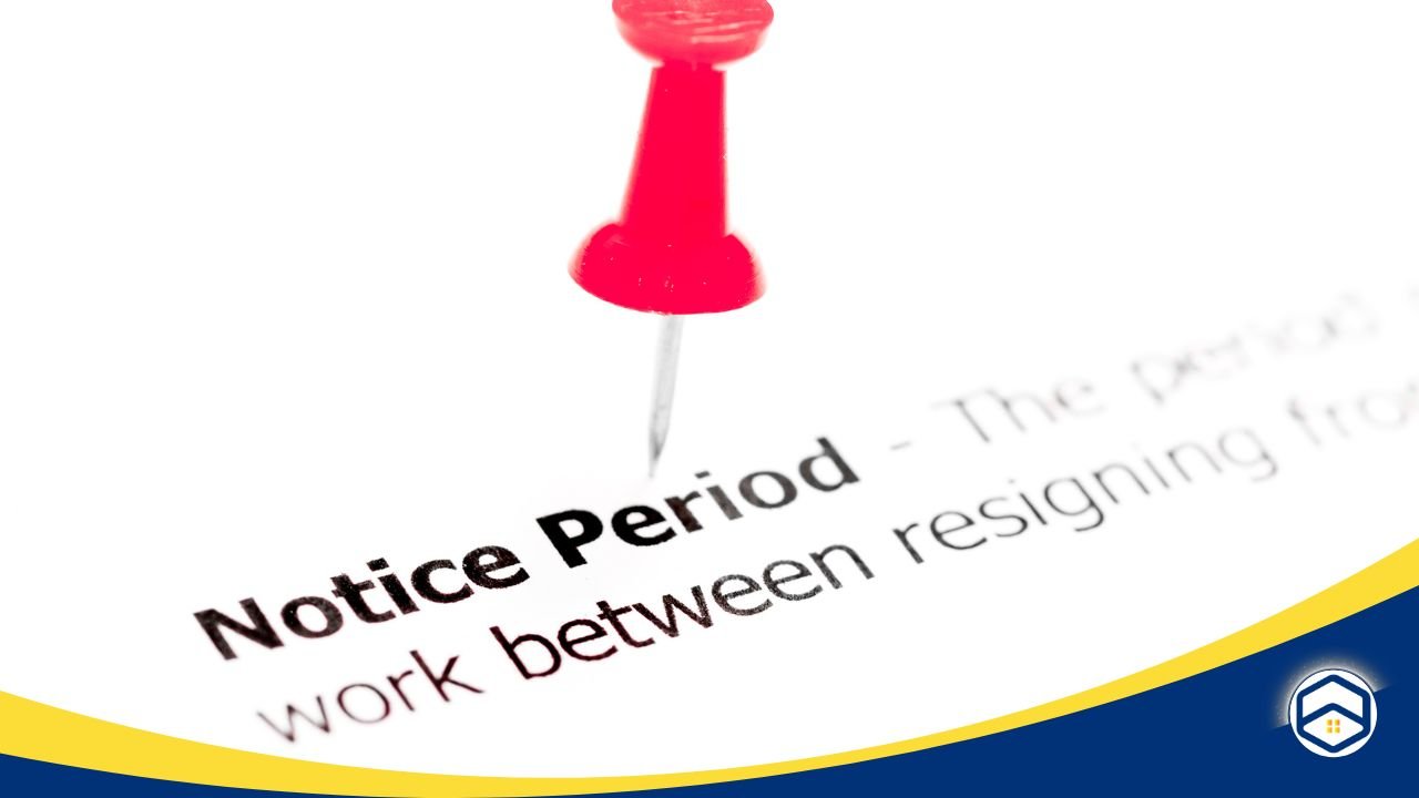 Close-up of a red pushpin highlighting 'Notice Period' on a document, emphasizing lease terms.