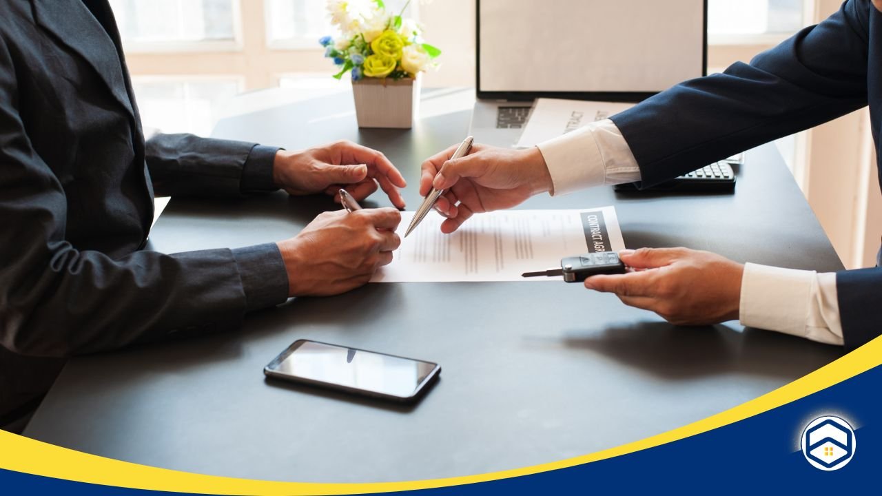 Two people signing a lease agreement at a desk, formalizing a rental extension - Houston Lease Renewal Process.