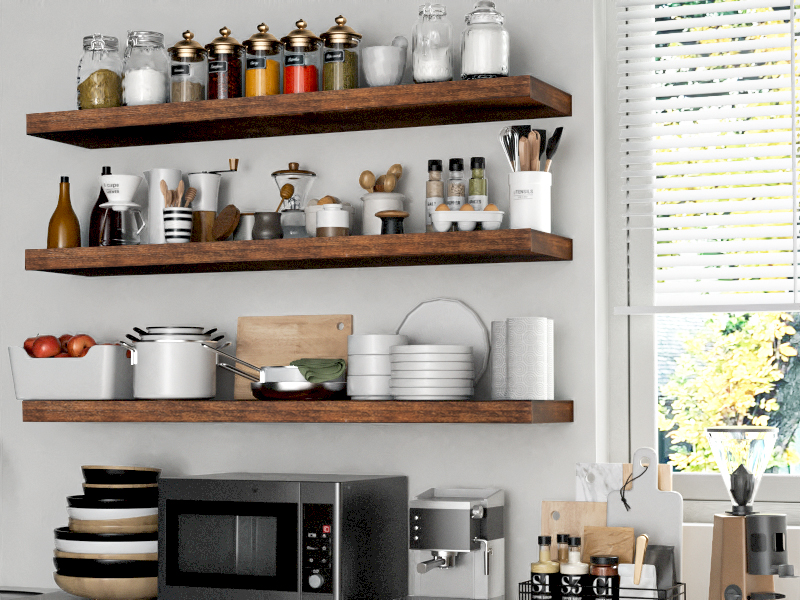 Houston Kitchen Storage Ideas. A modern kitchen setup featuring wooden floating shelves filled with spice jars, kitchen utensils, dishwares, and a microwave below.