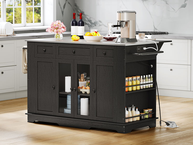 A stylish black kitchen island with a white countertop, featuring cabinets, drawers, spice racks, and a built-in power outlet, set in a contemporary kitchen.