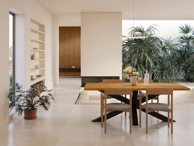 Modern minimalist dining room with a wooden table, indoor plants, and neutral color palette, illustrating natural minimalism tips and clean design in a Houston-inspired minimalist home.